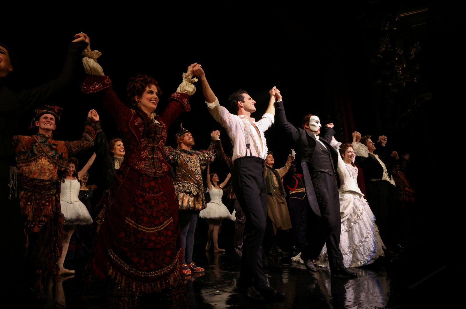 Cast members stand on the stage after performing on the reopening night of &quot;Phantom of the Opera&quot; at the Majestic Theater in New York City, New York, U.S., Oct. 22, 2021. (REUTERS)