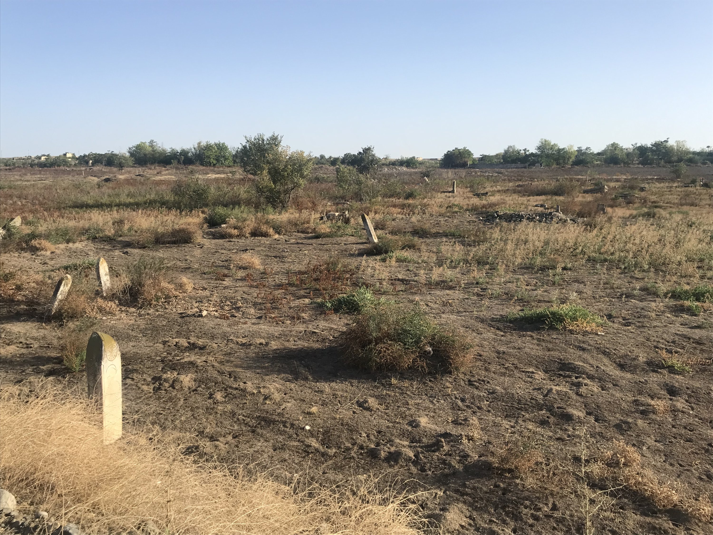 A cemetery is seen close to a village in Fuzuli, Karabakh, Azerbaijan, Sept. 17, 2022 (Photo by Dilara Aslan Özer)