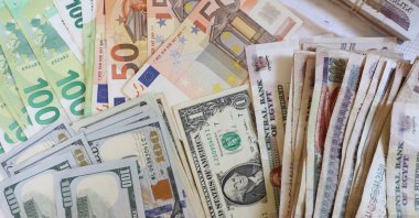 U.S. dollars and euros are seen inside a currency exchange office, in Cairo, Egypt, Sept. 7, 2022.  (EPA Photo)