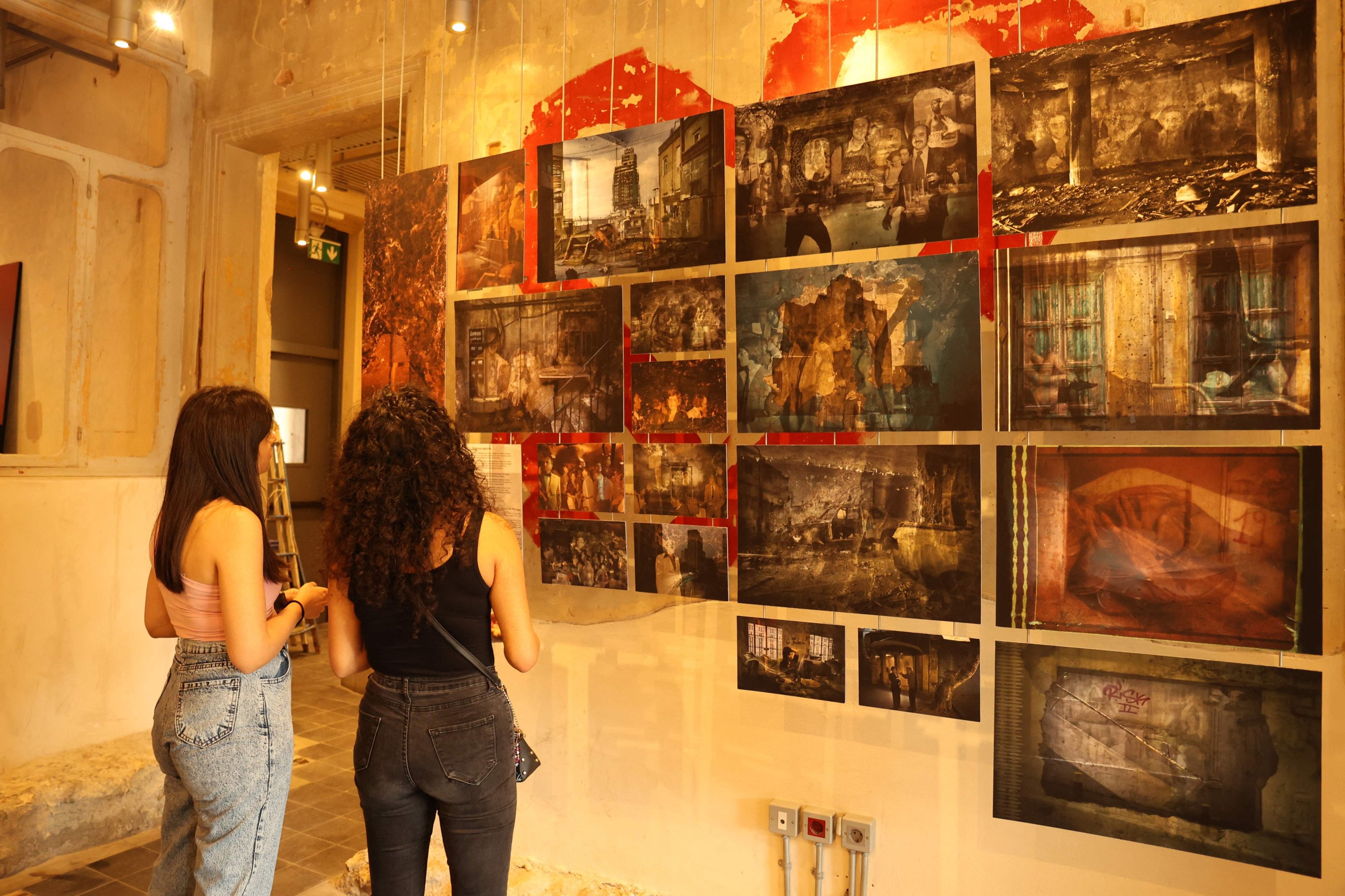 People in an exhibition titled "Allo, Beirut?," that shows archives of Lebanon's troubled past fused with artistic depictions of a grim present, at the capital's Beit Beirut heritage-house-turned-museum, Beirut, Lebanon, Sept. 15, 2022. (AFP Photo)