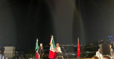 The Mexican Consulate's Istanbul Consul Isabel Arvide (R) and Deputy Consul Julio Escobado (L) waving the Mexican flag in the celebration, Istanbul, Türkiye, Sept. 16, 2022. (Photo by Buse Keskin)