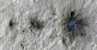 Craters formed by a Sept. 5, 2021, meteoroid impact on Mars, the first to be detected by NASA's InSight, are seen in an image taken by NASA's Mars Reconnaissance Orbiter. (Reuters Photo)