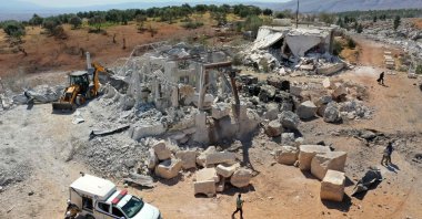 This aerial view shows the damage to buildings caused by a reported pro-regime forces bombing, in the Syrian opposition-held western countryside of Idlib, Syria, Sept. 8, 2022. (AFP Photo)