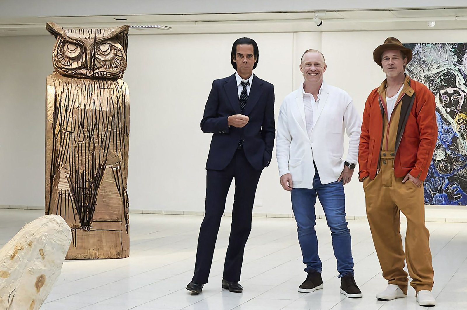 This handout photo taken on Sept. 17, 2022, and received on Sept. 19, 2022, shows British artist Thomas Houseago (C) posing with U.S. actor Brad Pitt (R) and Australian musician Nick Cave prior to the opening of the exhibition &quot;Thomas Houseago - WE with Nick Cave and Brad Bitt&quot; at The Sara Hilden Art Museum in Tampere, Finland. (AFP Photo)