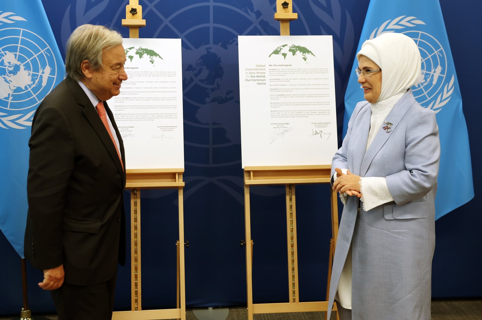 First lady Emine Erdoğan and U.N. Secretary-General Antonio Guterres pose in front of a goodwill agreement, in New York, U.S., Sept. 19, 2022. (AA PHOTO)