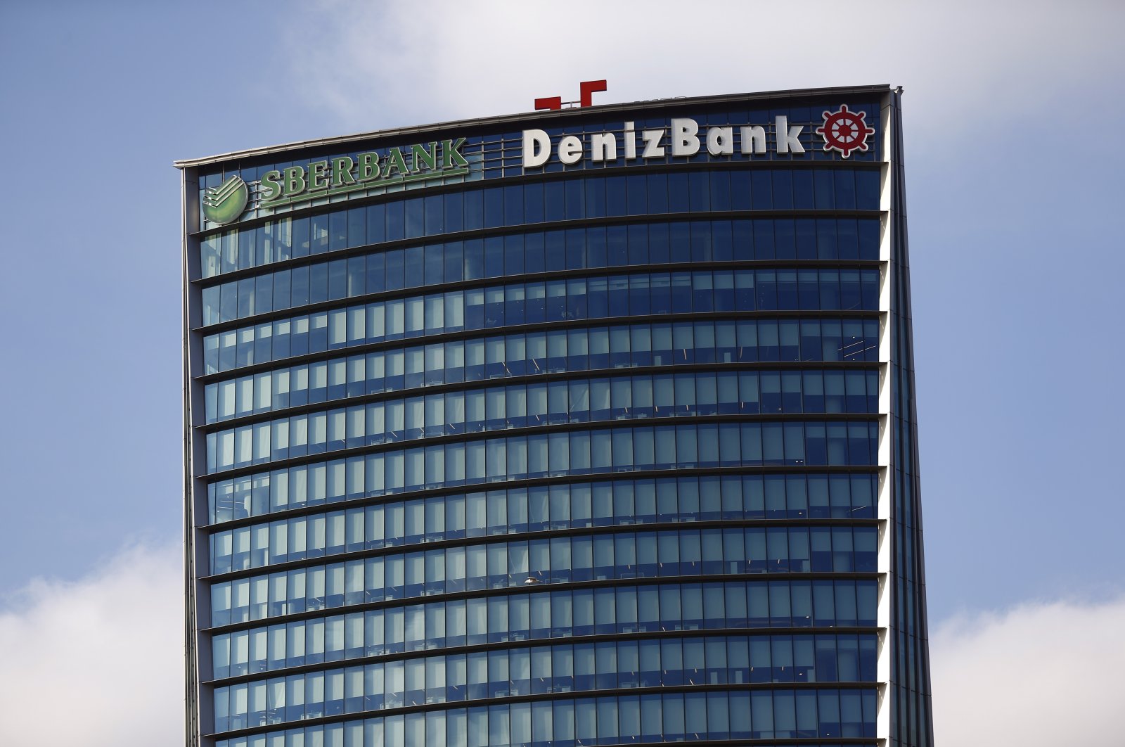 Logos of Russia&#039;s Sberbank (L) and Türkiye&#039;s DenizBank are seen on the headquarters of DenizBank in Istanbul, Türkiye, Jan. 27, 2016. (Reuters Photo)