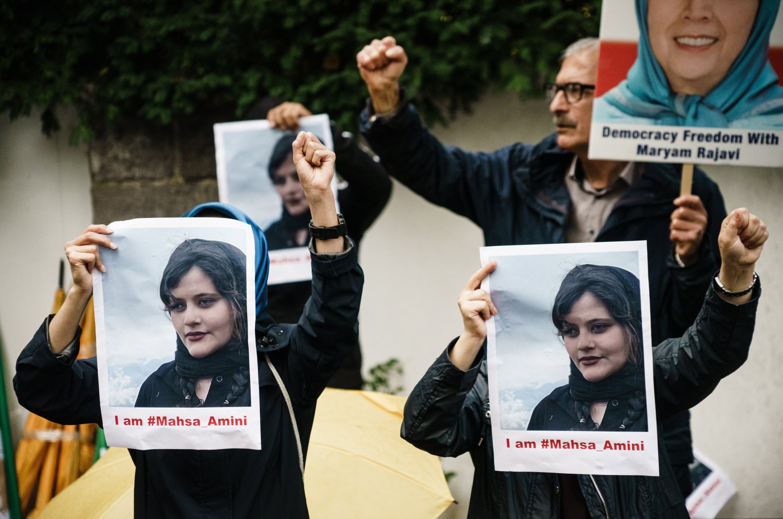 Protesters of the National Council of Resistance of Iran (NWRI) demonstrate with placards showing deceased Mahsa Amini, in front of the Islamic Republic of Iran Embassy in Berlin, Germany, Sept. 20, 2022. (EPA/CLEMENS BILAN)