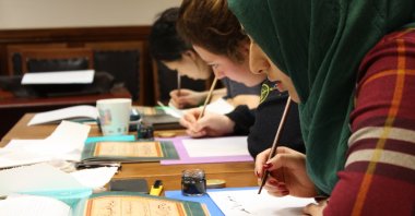 Students practice the art of calligraphy at the Yunus Emre Institute London, in London, U.K. (Photo courtesy of Yunus Emre Institute)