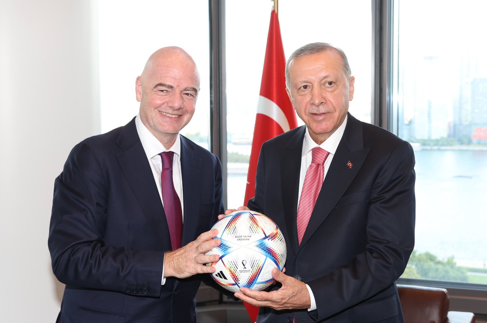 President Recep Tayyip Erdoğan (R) receives the Qatar 2022 World Cup official match ball from FIFA President Gianni Infantino, New York, U.S., Sept. 21, 2022. (DHA Photo)