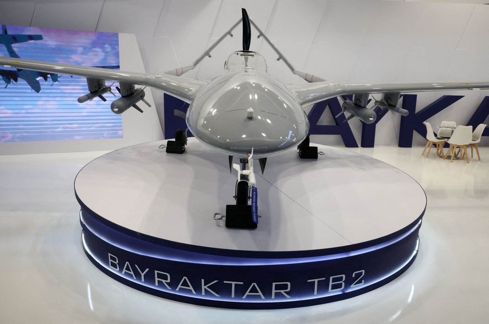 A Bayraktar TB2 drone stands near the logo of the Turkish defense company Baykar inside a hall of the 30th international Defence Industry Exhibition in Kielce, Poland, Sept. 5, 2022. (Reuters Photo)