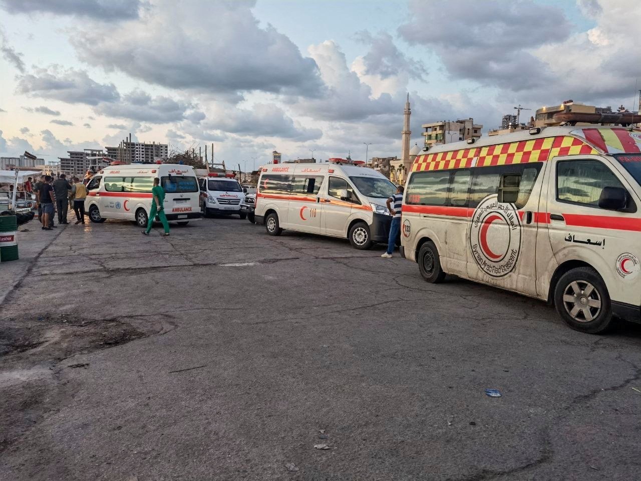 Ambulances are seen during the rescue process of migrants in the port of Tartous, Syria, Sept. 22, 2022, in this picture obtained from social media. (Saleh Sliman/via REUTERS)