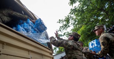 Members of the Puerto Rico National Guard distribute water in an affected community in the aftermath of Hurricane Fiona in Ponce, Puerto Rico, Sept. 21, 2022. (Reuters Photo)