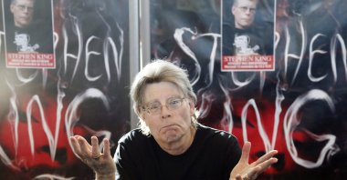 U.S. author Stephen King poses for the cameras during a promotional tour for &quot;Doctor Sleep,&quot; a sequel to &quot;The Shining,&quot; at a library in Paris, France, Nov. 13, 2013. (AP Photo)
