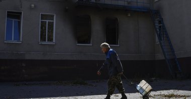 A man walks past a destroyed building after recent shelling in Bakhmut, Ukraine, Sept. 22, 2022. (AP Photo)