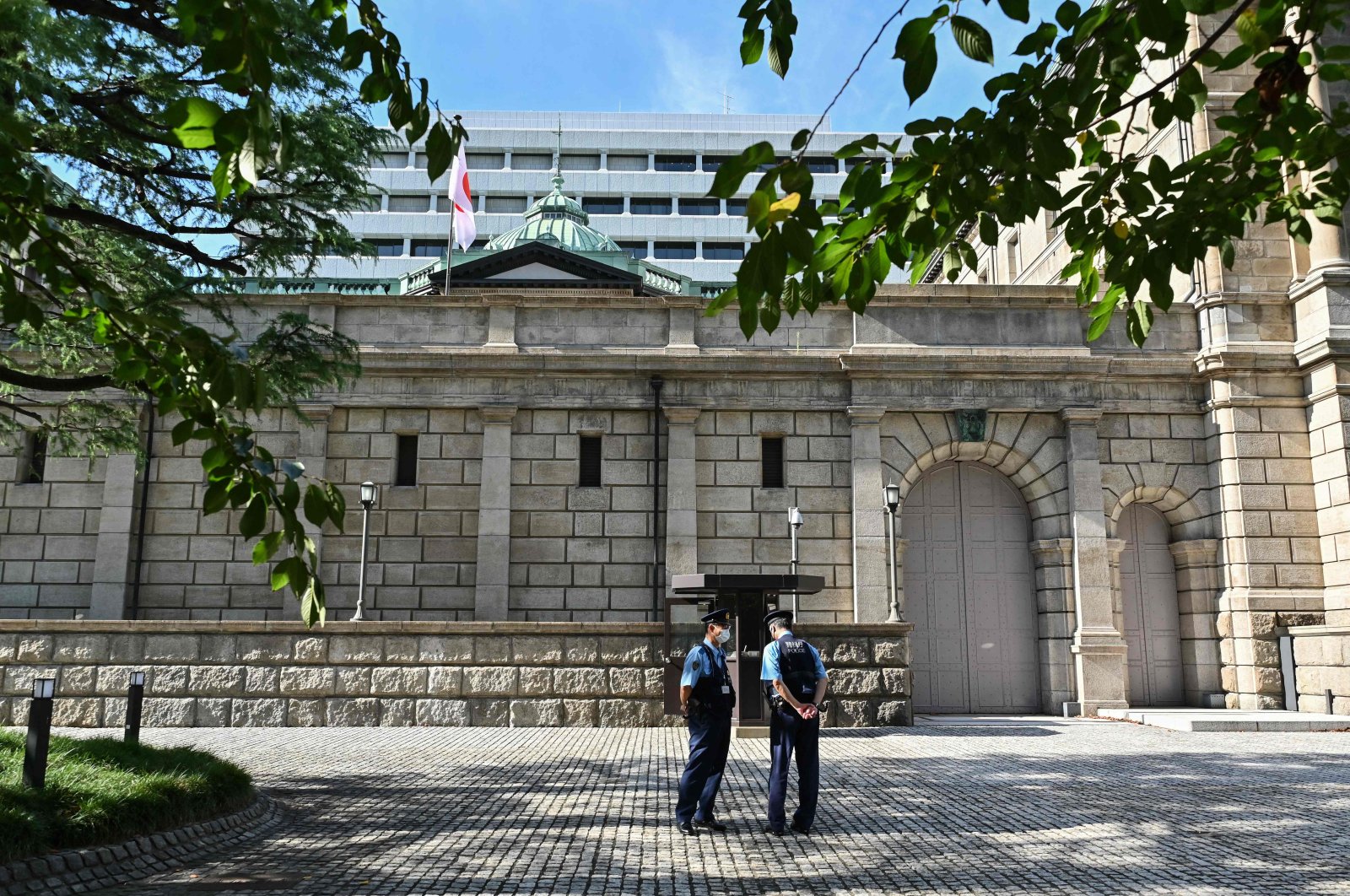 Members of security stand outside part of the Bank of Japan headquarters in Tokyo, Japan, Sept.14, 2022. (AFP Photo)