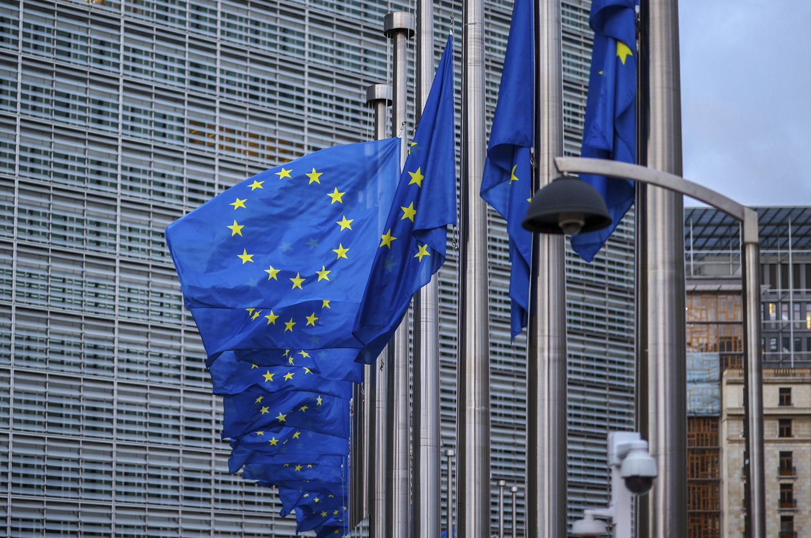 European Union flags flap in the wind at half mass outside EU headquarters in Brussels, Belgium, Sept. 9, 2022. (AP File Photo)