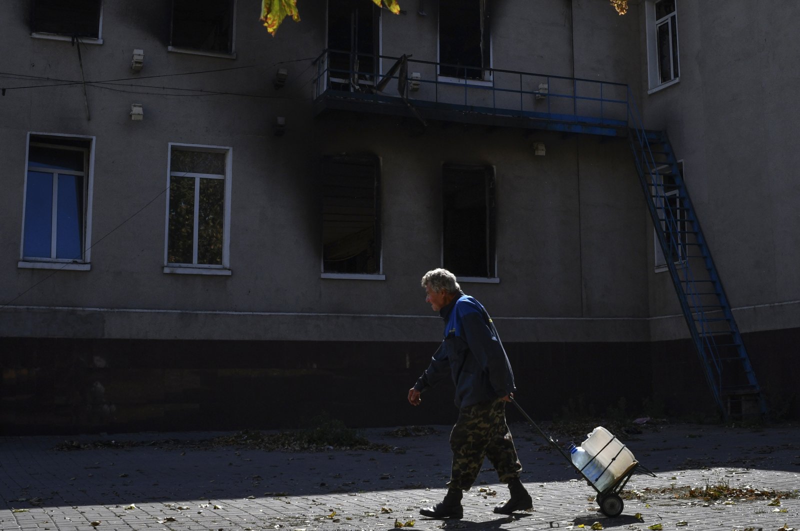 A man walks past a destroyed building after recent shelling in Bakhmut, Ukraine, Sept. 22, 2022. (AP Photo)