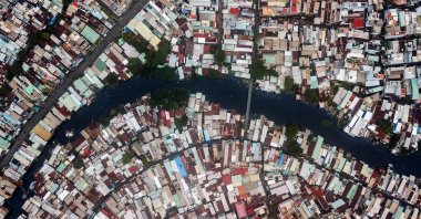 Houses are seen along the Xuyen Tam canal in Ho Chi Minh City, Vietnam, Oct. 19, 2018. (AFP Photo)