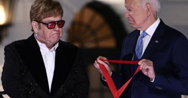 British singer Elton John gets emotional as U.S. President Joe Biden presents him with the National Humanities Medal at the end of "A Night When Hope and History Rhyme" at the White House in Washington, D.C., U.S., Sept. 23, 2022. (AFP Photo)