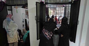 People gather to mourn the death of their young neighbor Usmaan, 15, who was killed by lightning on Friday at Prayagraj, Uttar Pradesh, northern India, Sept. 24, 2022. (AP Photo)