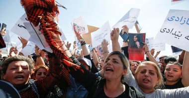 People take part in a protest following the death of Mahsa Amini in front of the United Nations headquarters in Irbil, Iraq, Sept. 24, 2022. (Reuters Photo)