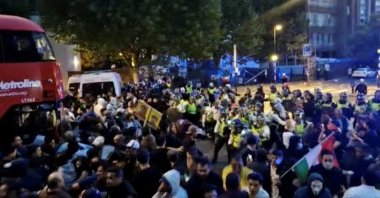 Police confront protesters during demonstrations following the death of Mahsa Amini in Iran, in London, Britain, Sept. 25, 2022 in this screen grab obtained from social media video.  (Photo via Reuters)