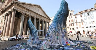 Life-size mock-up of two whales emerge from a sea filled with plastic waste in front of Rome’s Pantheon, Italy, July 5, 2018. (AP Photo)