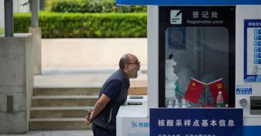 A man gets tested for COVID-19 at a nucleic acid testing site, following the coronavirus disease outbreak, in Shanghai, China, Sept. 23, 2022. (Reuters Photo)