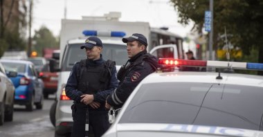 Russian policemen stand near the scene of a school shooting at school 88 in Izhevsk, Russia, Sept. 26, 2022. (EPA Photo)