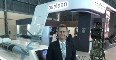 The company's CEO Haluk Görgün poses at Aselsan's booth in tje defense fair, in Pretoria, South Africa, Sept. 21, 2022. (AA PHOTO)