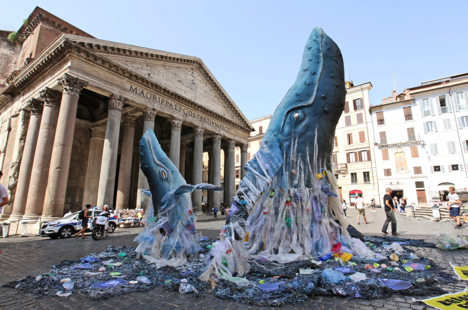 Life-size mock-up of two whales emerge from a sea filled with plastic waste in front of Rome’s Pantheon, Italy, July 5, 2018. (AP Photo)