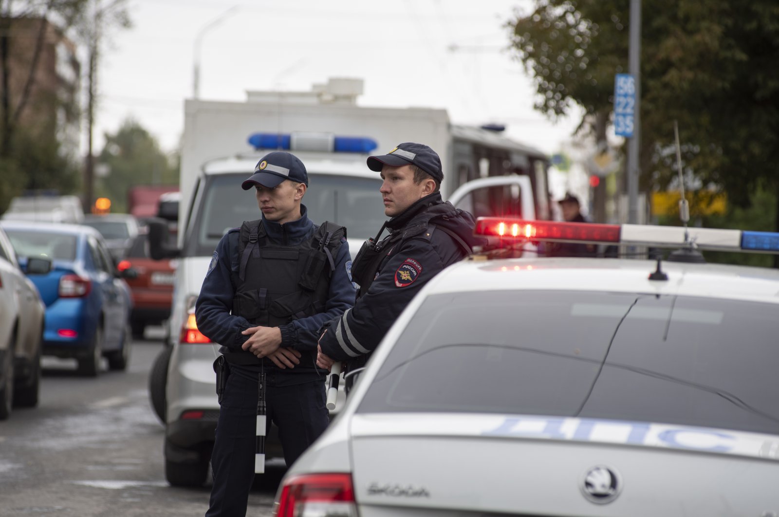 Russian policemen stand near the scene of a school shooting at school 88 in Izhevsk, Russia, Sept. 26, 2022. (EPA Photo)