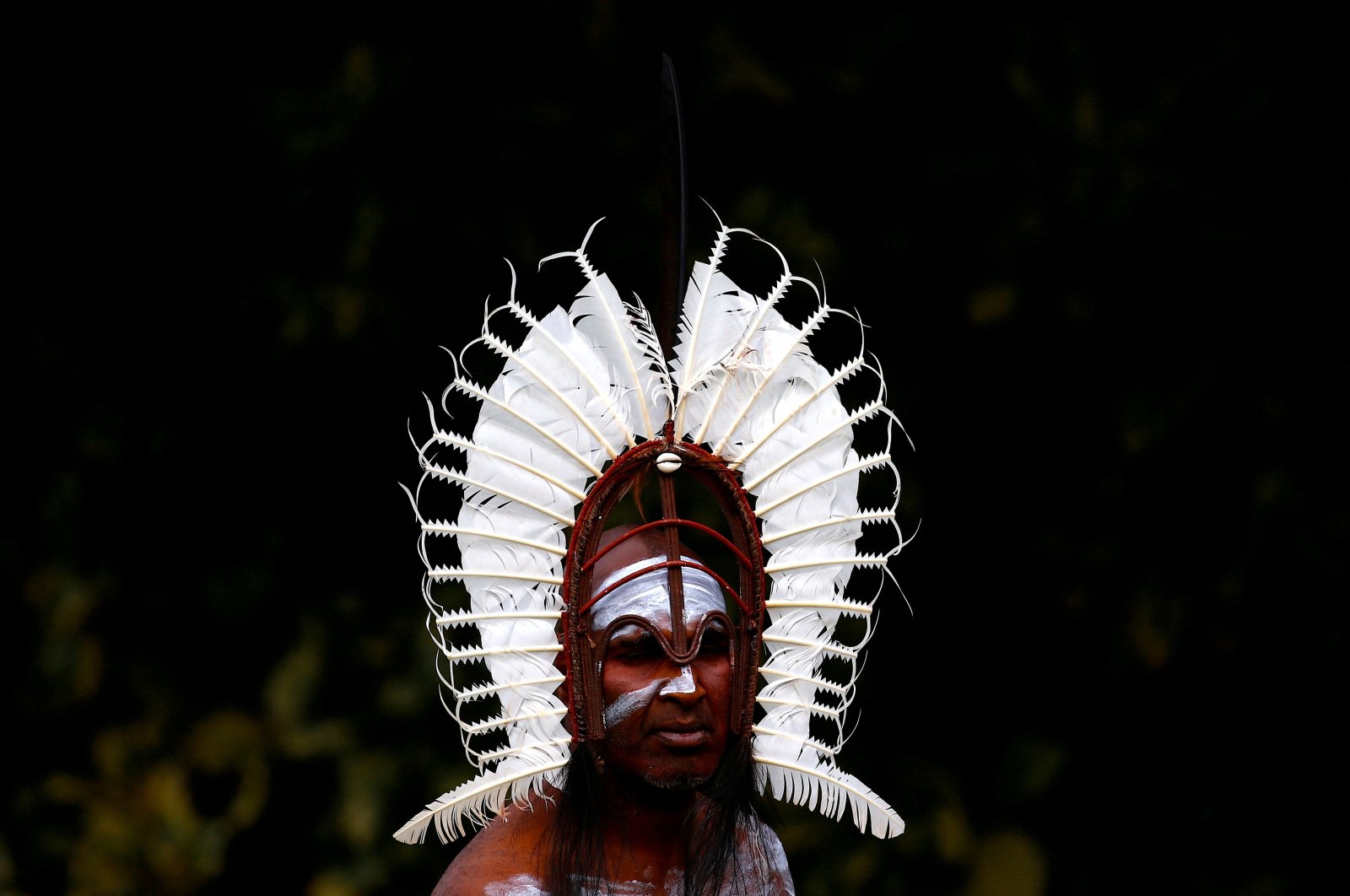 An indigenous man from the Torres Strait Islands wears a traditional dress as he performs during a welcoming ceremony at Government House in Sydney, Australia, June 28, 2017. (Reuters Photo)