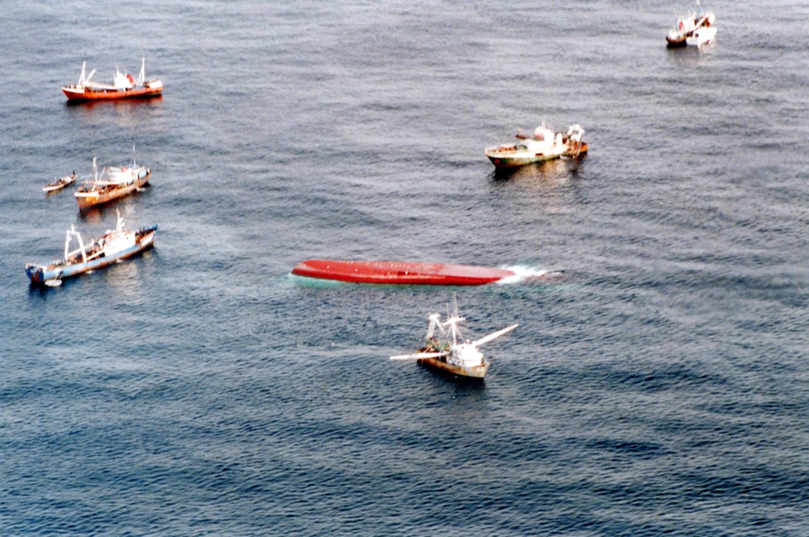 In this handout file photograph released by France&#039;s Marine Nationale on Sept. 27, 2002, fishing boats carrying rescuers search for those missing and feared drowned after the passenger ferry Le Joola (C), capsized in stormy seas off the coast of the west African nation of Senegal. (Marine Nationale via AFP)