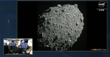 This screengrab made from NASA live feed shows Dimorphos just before the Double Asteroid Redirection Test (DART) made impact with the asteroid, as watched by the NASA team (bottom L) at DART headquarters in Laurel, Maryland, U.S., Sept. 26, 2022. (AFP Photo)