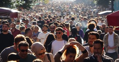 People walk on Istiklal Avenue, in Istanbul, Türkiye, Sept. 25, 2022. (İHA PHOTO)