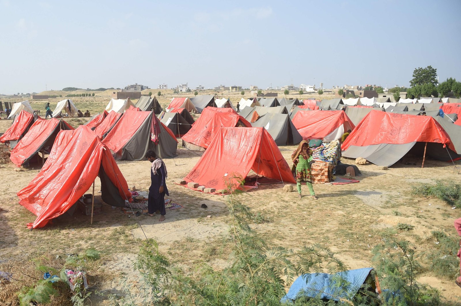 Internally displaced flood-affected people take refuge at a makeshift camp in the Jamshoro district of Sindh province, Pakistan, Sept. 26, 2022. (AFP Photo)
