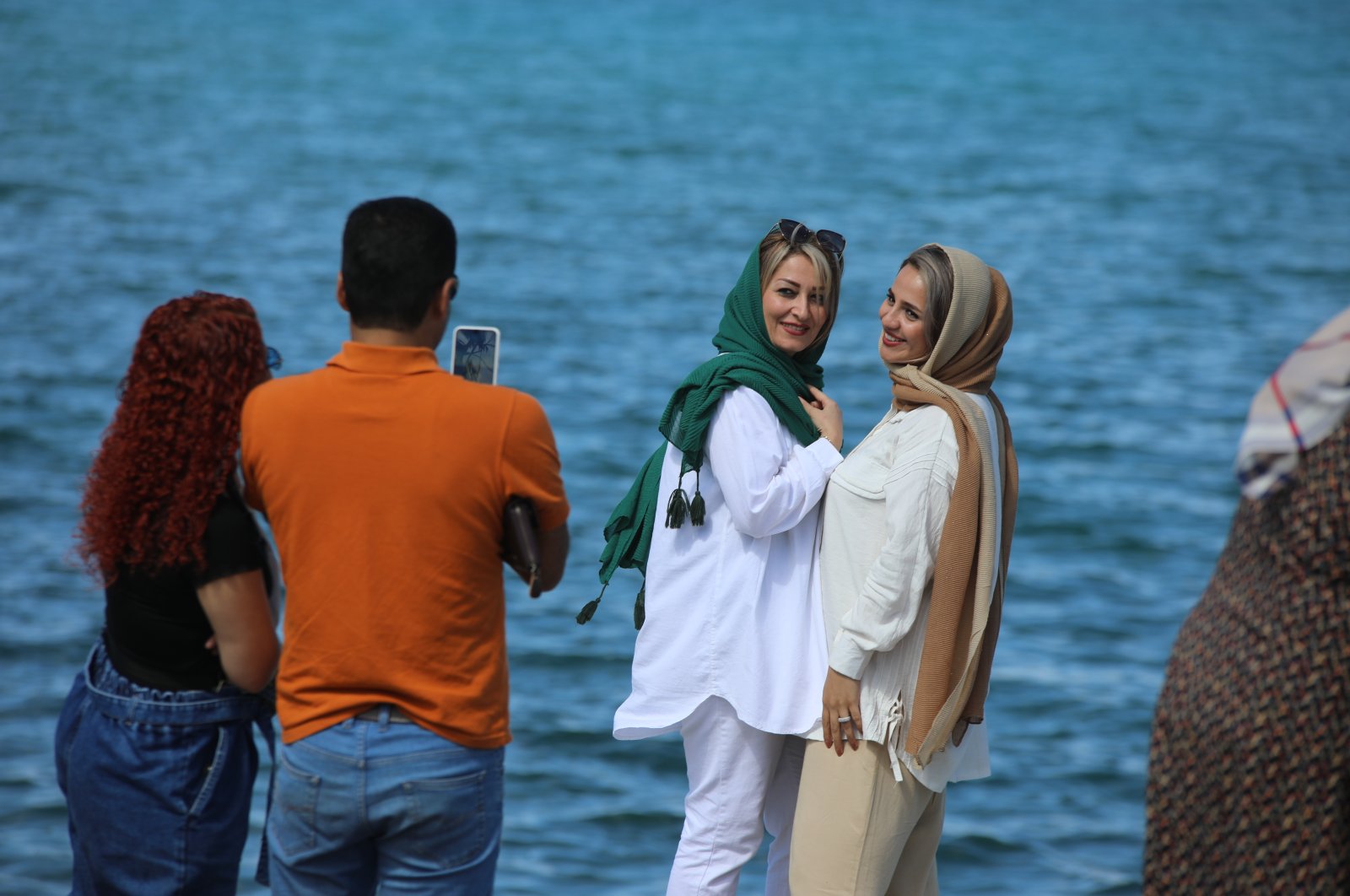 Iranian tourists pose for a photo near famed Lake Van, in Van, eastern Türkiye, Sept. 24, 2022. (AA Photo)