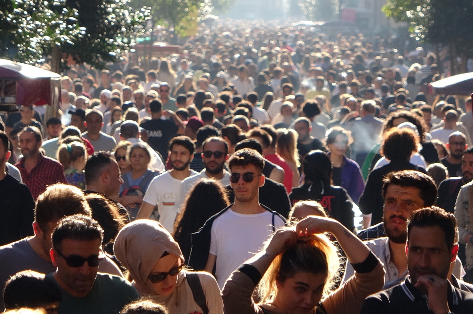 People walk on Istiklal Avenue, in Istanbul, Türkiye, Sept. 25, 2022. (İHA PHOTO)