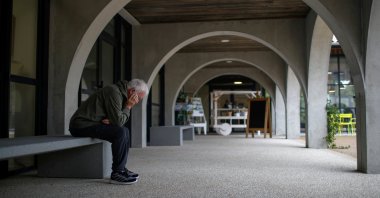 An Alzheimer&#039;s patient rests on a bench after a walk at the Village Landais Alzheimer site in Dax, France, Sept. 24, 2020. (Reuters Photo)