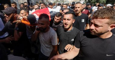 Mourners carry the body of Abdulrahman Khazem, who was killed by Israeli forces in a raid, during his funeral in Jenin, Israeli-occupied West Bank, Sept. 28, 2022. (Reuters Photo)