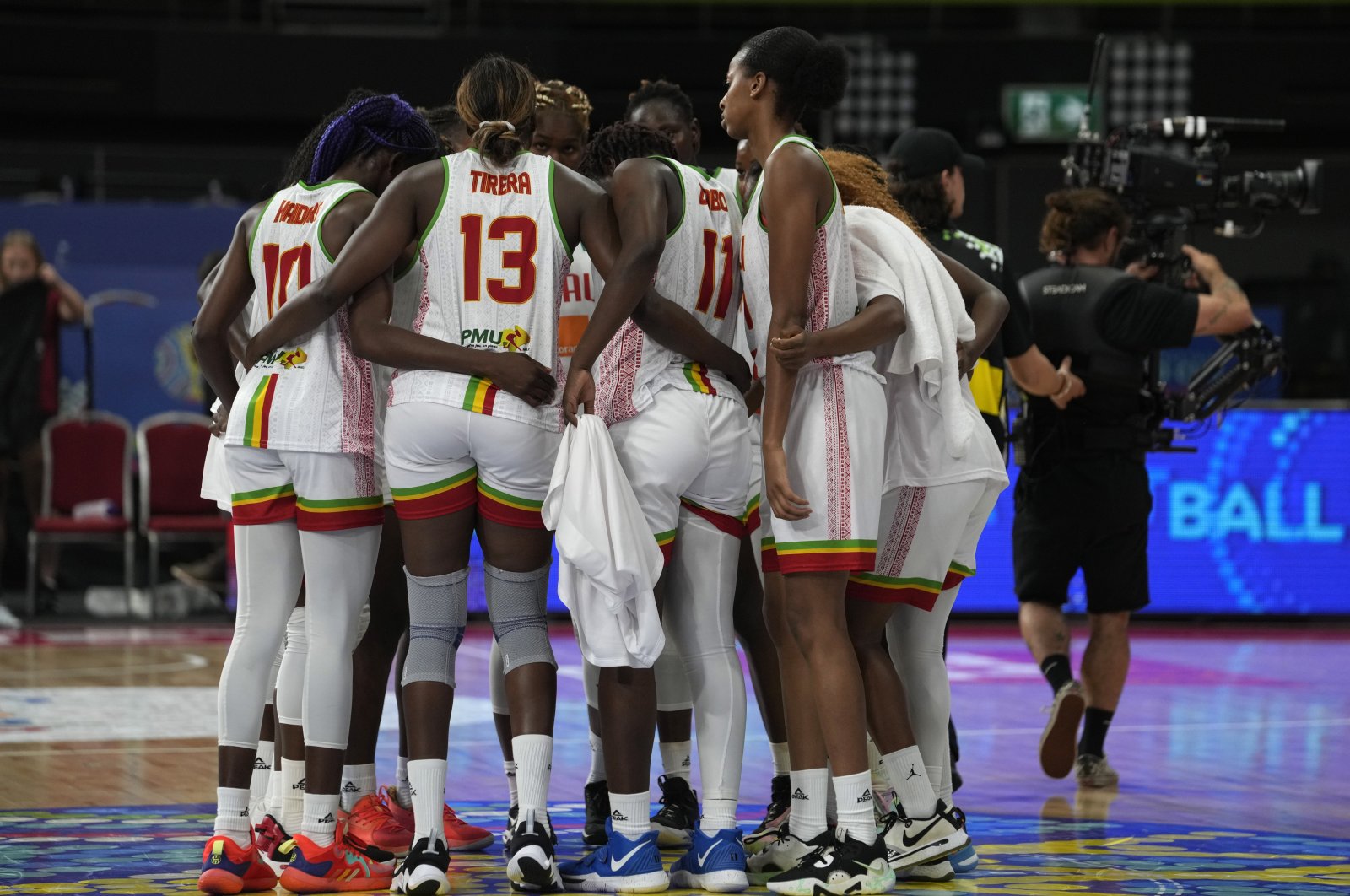 Mali players huddle together after their loss to Canada in their game at the women&#039;s Basketball World Cup in Sydney, Australia, Sept. 27, 2022. (AP Photo)