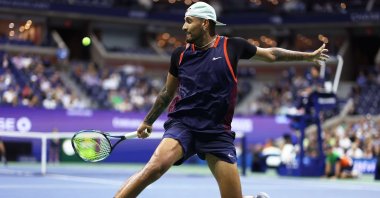 Australian Nick Kyrgios returns a shot against Karen Khachanov during their Men Singles Quarterfinal match on Day Nine of the 2022 U.S. Open at USTA Billie Jean King National Tennis Center. Sept. 6, 2022 (AFP Photo)