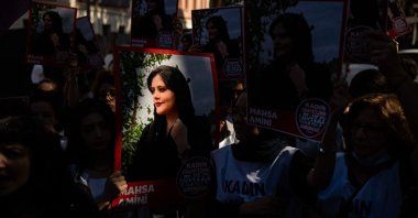 Protestors hold banners with the portrait of Iranian Mahsa Amini as they take part in a rally outside the Iranian Consulate in Istanbul, Türkiye, Sept. 29, 2022. (AFP Photo)