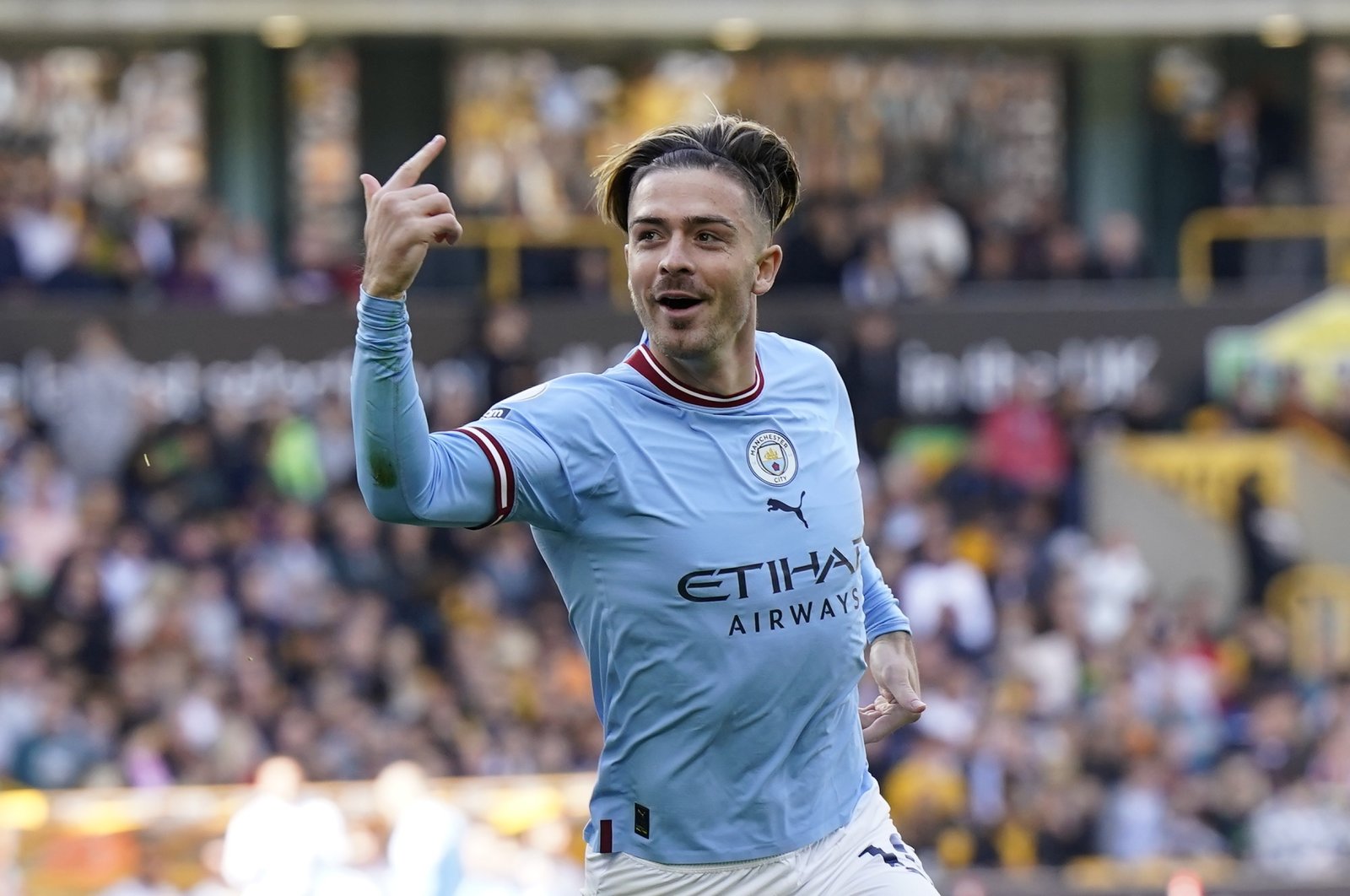 Manchester City&#039;s Jack Grealish celebrates after scoring the 1-0 lead during the English Premier League match between Wolves and Manchester City, Wolverhampton, Britain, Sept. 17, 2022. (EPA Photo)