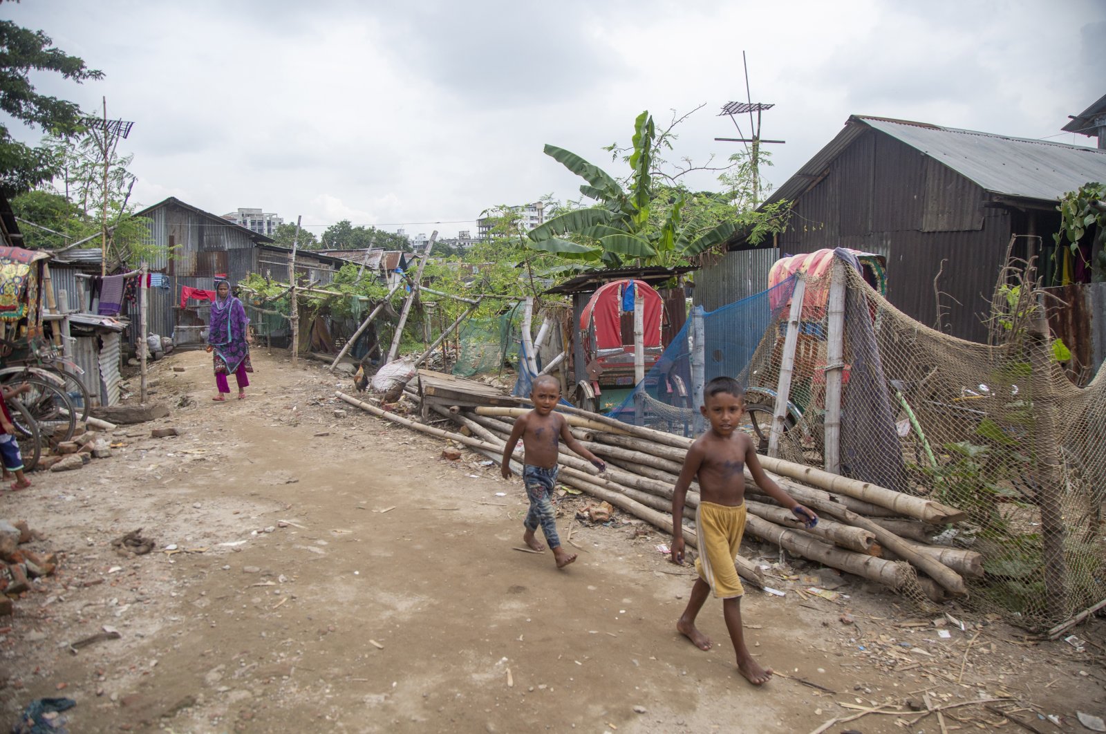 Children walk in the Kalyanpur slum area in Dhaka, Bangladesh, Sept. 11. (EPA Photo)