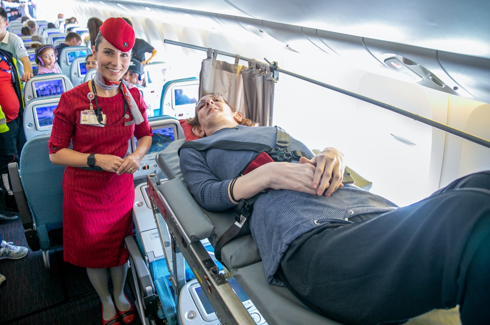Rumeysa Gelgi lies on the stretcher aboard the plane, in Istanbul, Türkiye, Sept. 28, 2022. (AA PHOTO) 