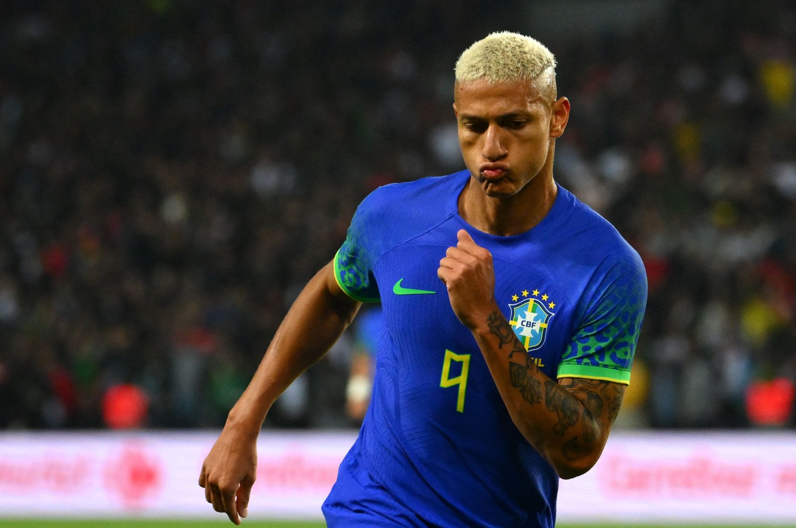 Brazil&#039;s forward Richarlison celebrates after scoring his team&#039;s second goal during the friendly football match between Brazil and Tunisia at the Parc des Princes. Paris, Sept. 27, 2022. (AFP Photo)