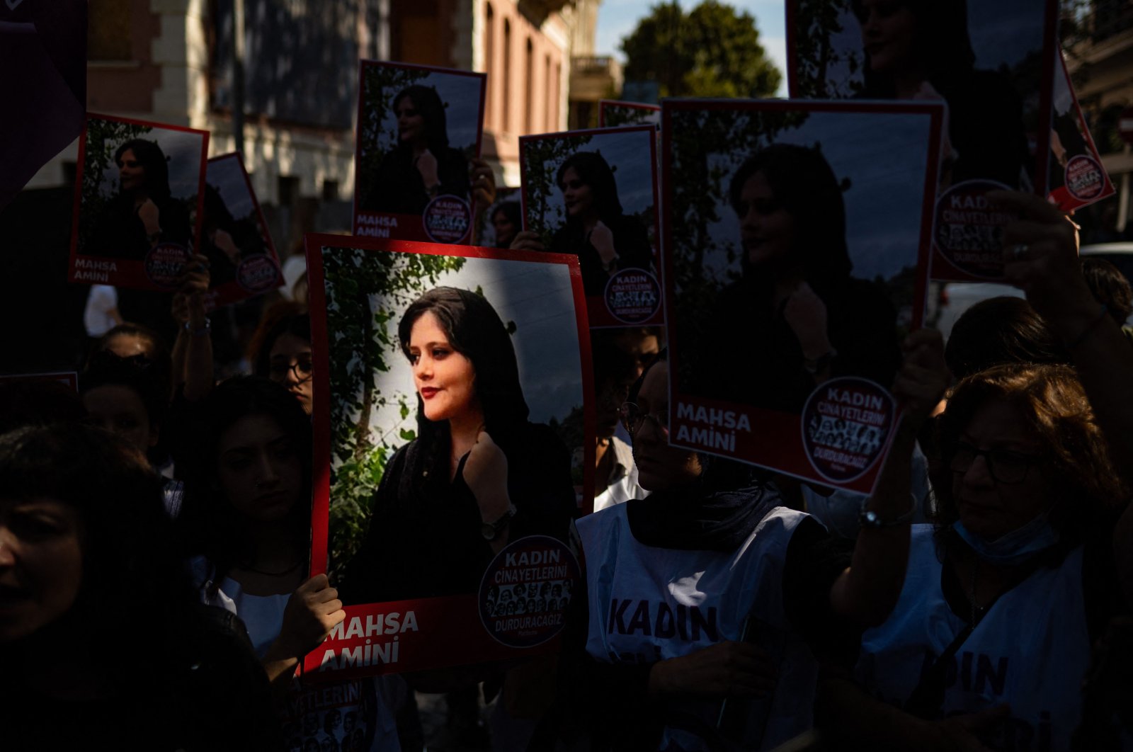Protestors hold banners with the portrait of Iranian Mahsa Amini as they take part in a rally outside the Iranian Consulate in Istanbul, Türkiye, Sept. 29, 2022. (AFP Photo)