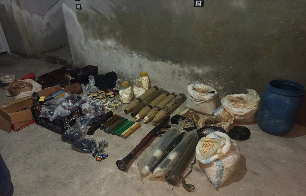 Explosives, weapons and ammunition of a Daesh cell in Syria are seen in this photo, Sept.30, 2022 (IHA Photo) 